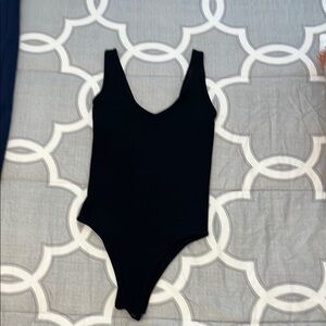 Black Bodysuit with Scoop Neckline and Sleeveless Design